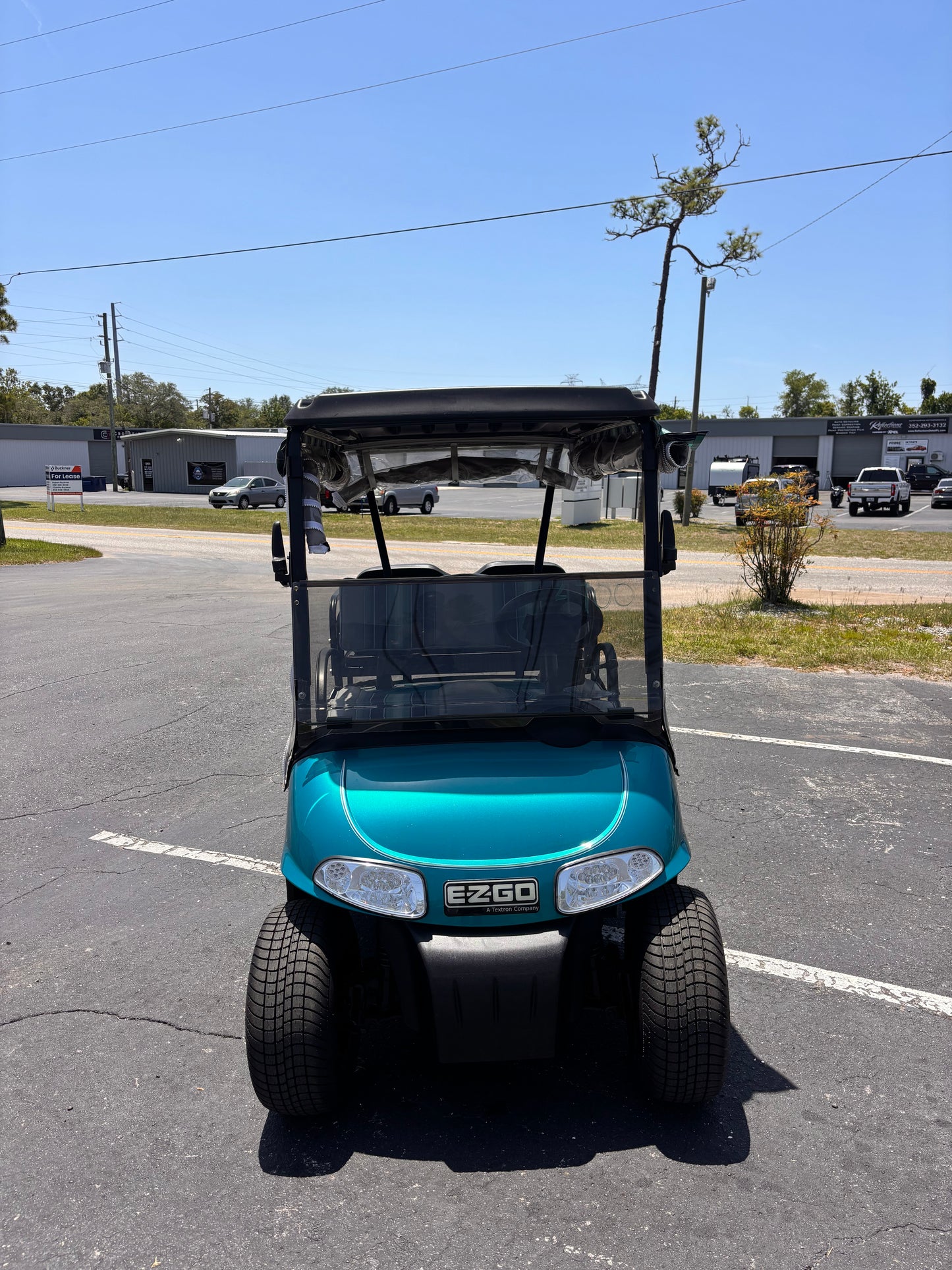 Turquoise 4 seater EZGO golf cart