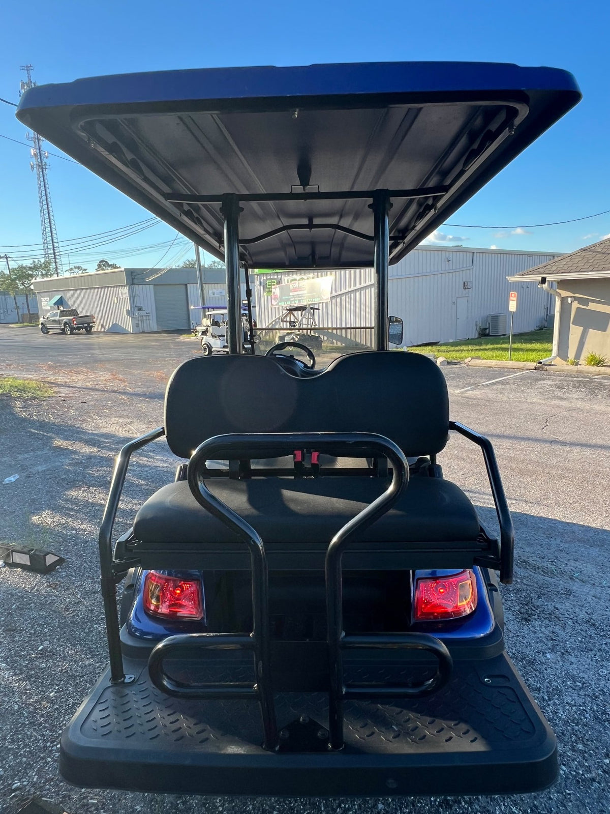 2021 Advanced EV golf cart in blue, rear view
