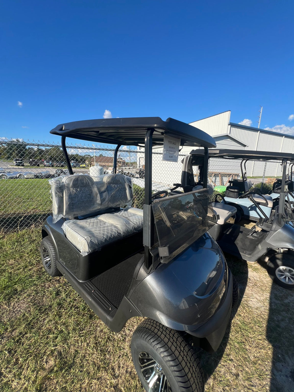 2021 E-Z-GO RXV Elite Grey — side view